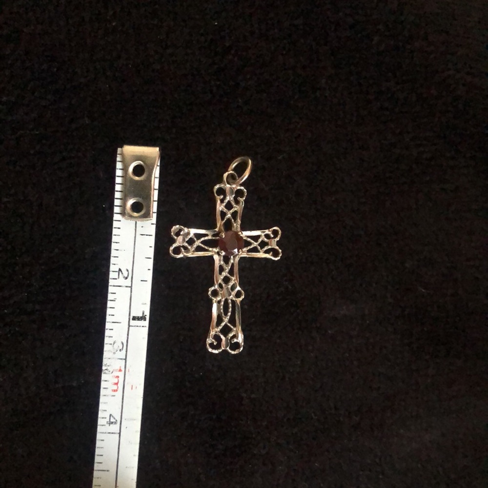 Real 14 karat gold Garnet cross pendant. It was custom-made.